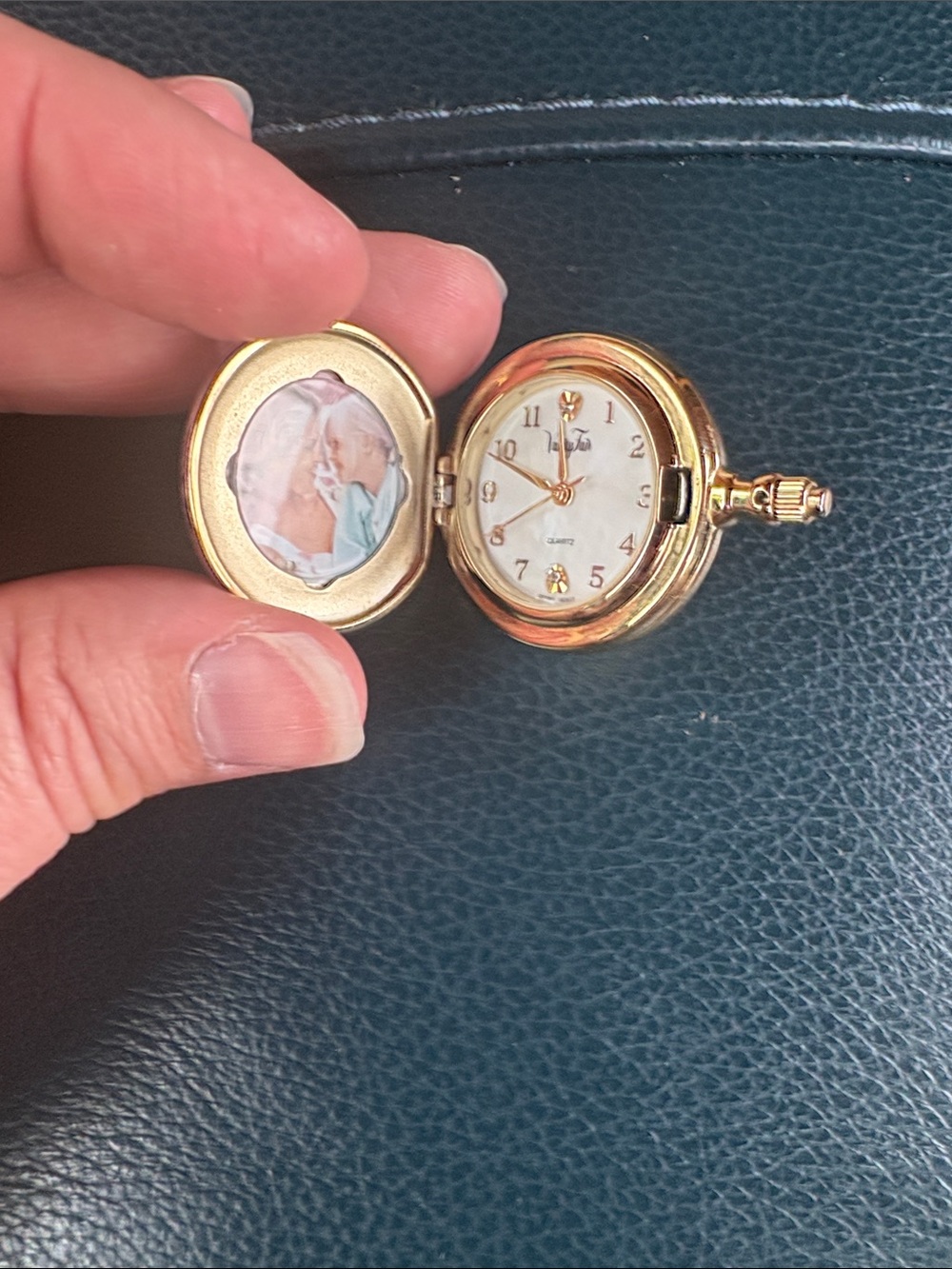 Vanity Fair Gold Locket Pendant Watch with White Dial needs battery